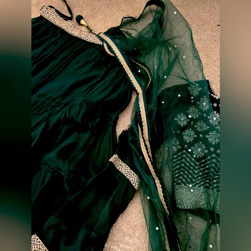 Dark green indian lehenga.